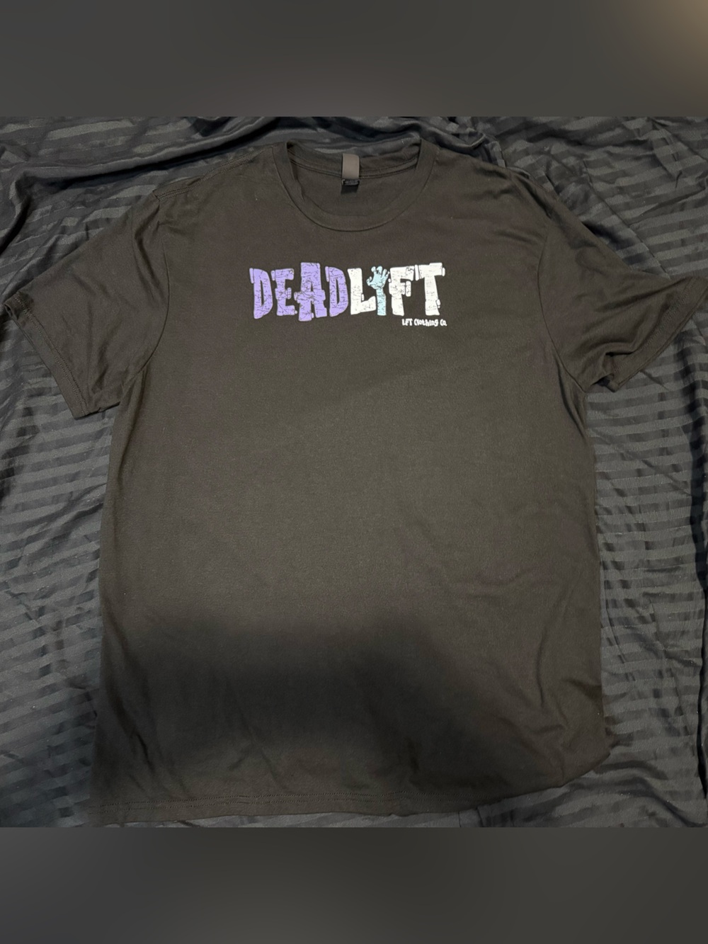 District Men’s Black DEADLIFT Logo Tee with Purple and Light Blue Accents